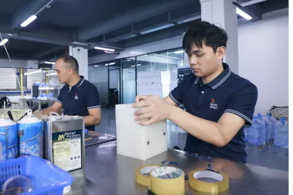 worker processing vacuum cast mold